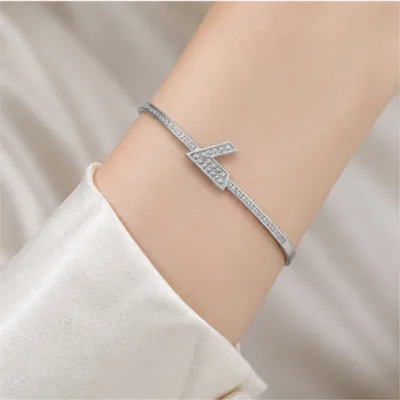 Silver-tone crystal bangle 84854-04 worn on the wrist