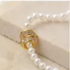 Colar de Pérolas com Pendente de Elos — Dourado