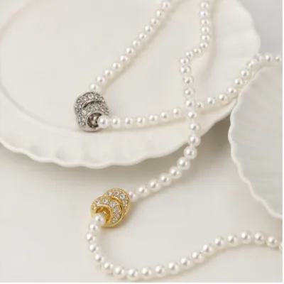 Pearl necklaces with interlocking loop pendants 84989-01