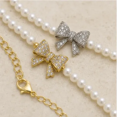 Close-up of pearl necklace bow and clasp 84989-03