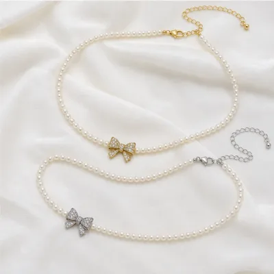 Gold and silver bow pearl necklaces 84989-03