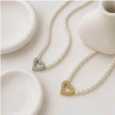 Pearl necklaces with open heart pendants 84990-01