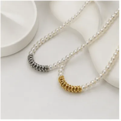 Pearl necklaces with ribbed coil centrepieces 84991-04
