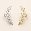 Ear cuffs de ramo com cristais em prateado e dourado