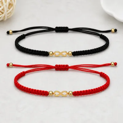 Variantes preta e vermelha da pulseira ajustável com infinito dourado