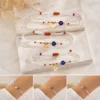 Conjunto de pulseiras ajustáveis com olho azul e amuletos dourados