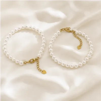 Two white 6 mm pearl bracelet models 85082-01