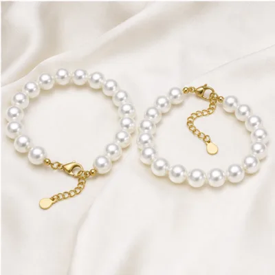 Two white 8 mm pearl bracelet models 85083-01