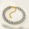 Pulseira de Pérolas de 8 mm com Corrente Dourada — Cinzento