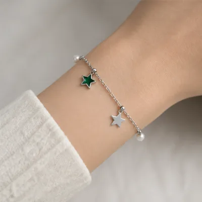Silver and green star bracelet 85201-03-3 worn on wrist