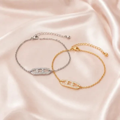 Pulseira em aço dourado em composição