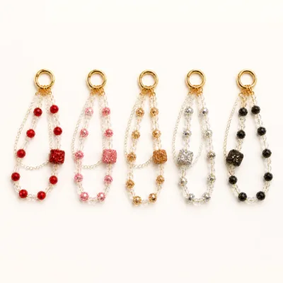 Pulseiras para telemóvel com zircónia em cinco cores e argolas douradas