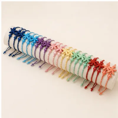 Conjunto completo de 24 pulseiras de cordão com estrelas-do-mar coloridas