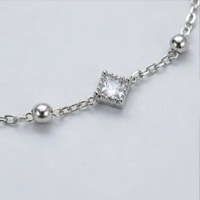 Close view of square stone and polished bead on bracelet 85391-2