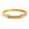 Bracelete Modelo A dourado com barra retangular de cristais