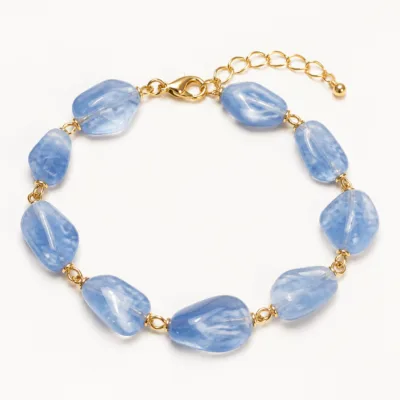Variante C azul da pulseira dourada com pedras irregulares