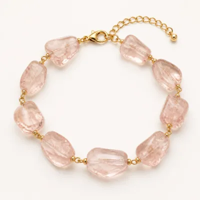 Variante D rosa da pulseira dourada com pedras irregulares