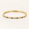 Pulseira Dourada e Preta com Cristais — Dourado e preto
