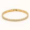 Pulseira Dourada com Cristais Brancos — Dourado e branco