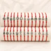 Conjunto completo de 24 pulseiras vermelhas com amuletos prateados