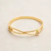 Pulseira Rígida Dupla com Berloque de Cristal — Dourado